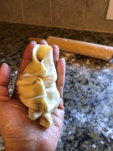 Steamed Bao Folding - seal the last remaining opening downwards into the center