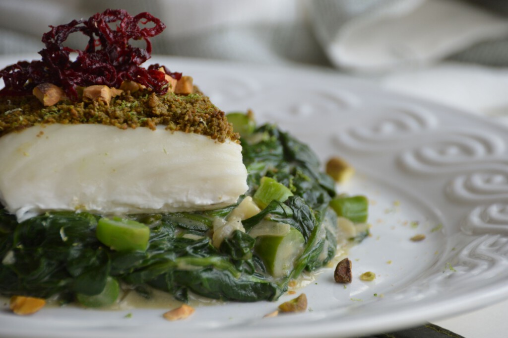 Creamed Spinach with Pistachio Matcha Crusted Halibut on top